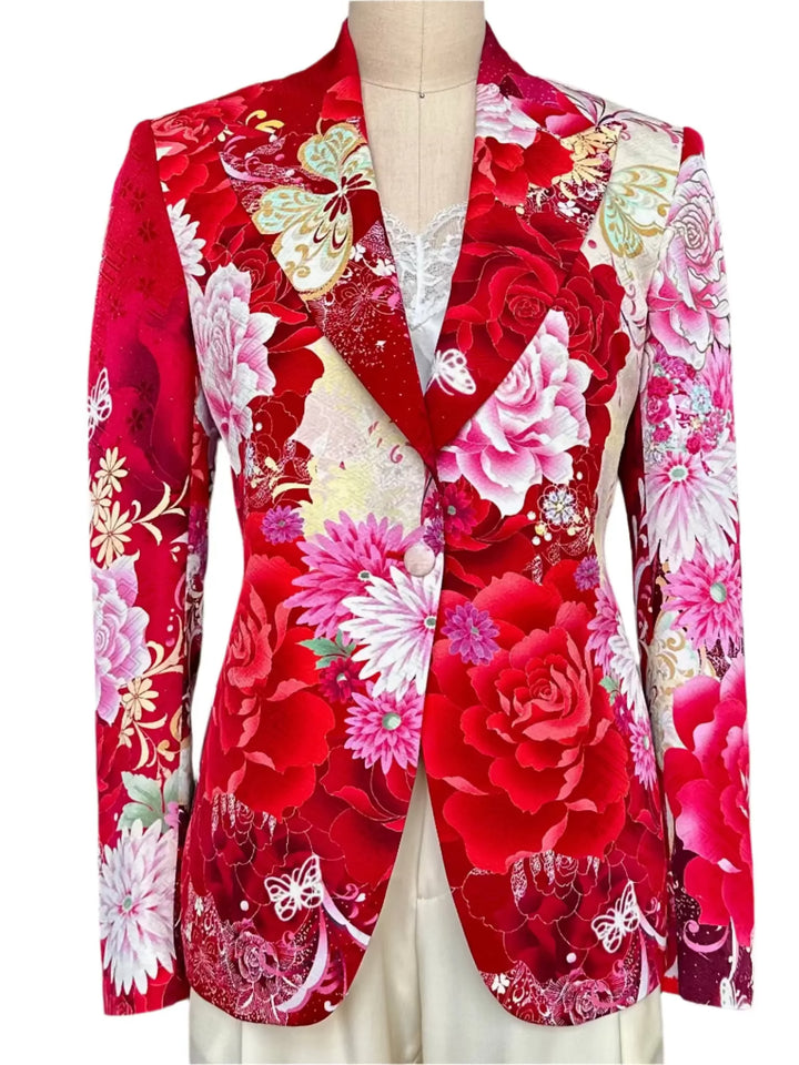 Red floral patterned jacket on a mannequin against a neutral background