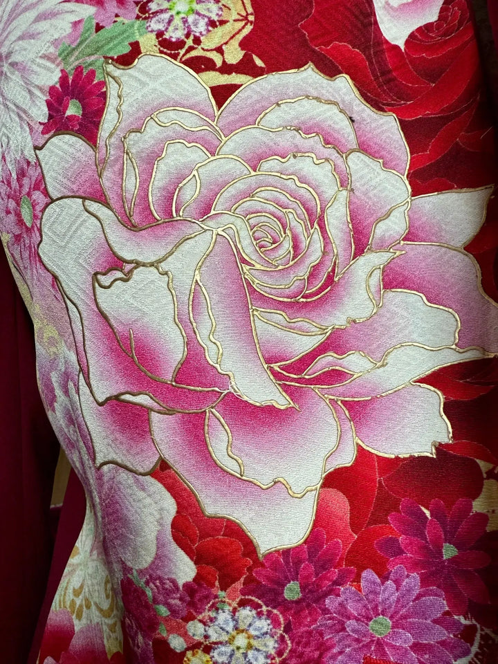 Closeup of gold embroidery on the GARNET AND BLOOMS KIMONO JACKET - Nigel Curtiss