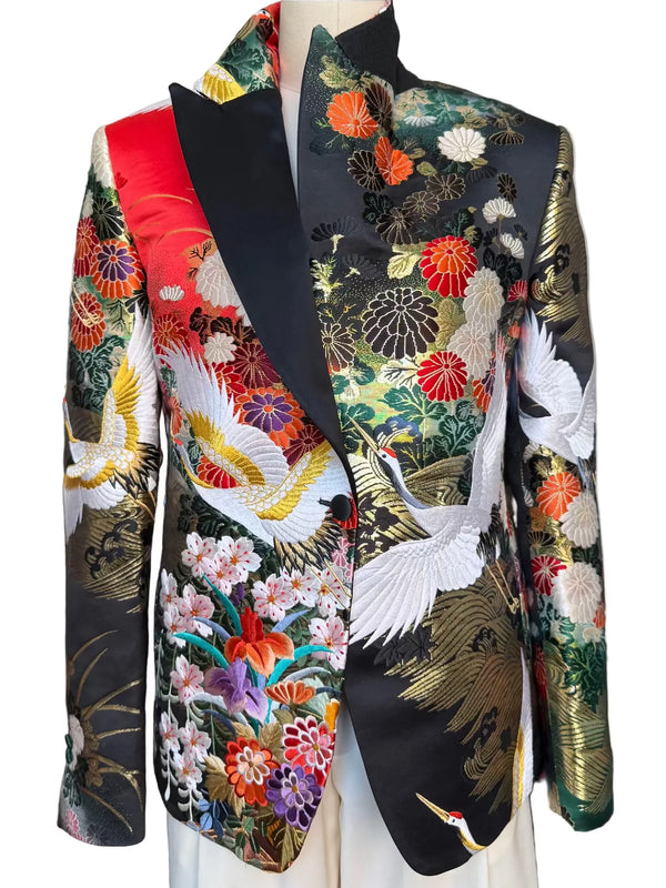 Front view of MIDNIGHT GARDEN KIMONO JACKET with Black satin lapel. Detail of gold embroidered cranes on vintage uchikake silk. Nigel Curtiss
