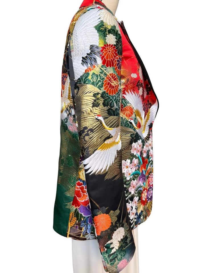 Side view of MIDNIGHT GARDEN KIMONO JACKET with Black satin lapel. Detail of gold embroidered cranes on vintage uchikake silk. Nigel Curtiss GARDEN KIMONO JACKET - Nigel Curtiss